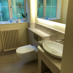 bathroom with light surround mirror in Tilehurst, Reading