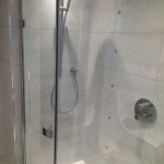 bathroom shower with grey tiles in Tilehurst, Reading