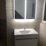floating sink with mirror cabinet with lighting surround in Tilehurst, Reading